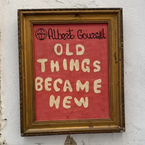 Old Things Became New sign at a Lisbon flea market